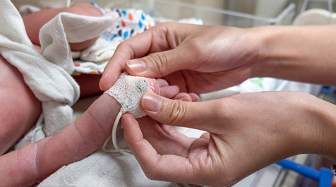 NNP tending to baby