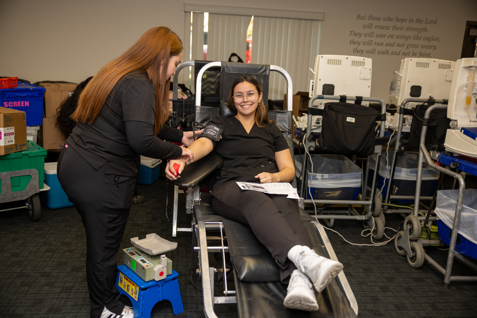 A blood donor participates in the Nursing Hearts blood drive.