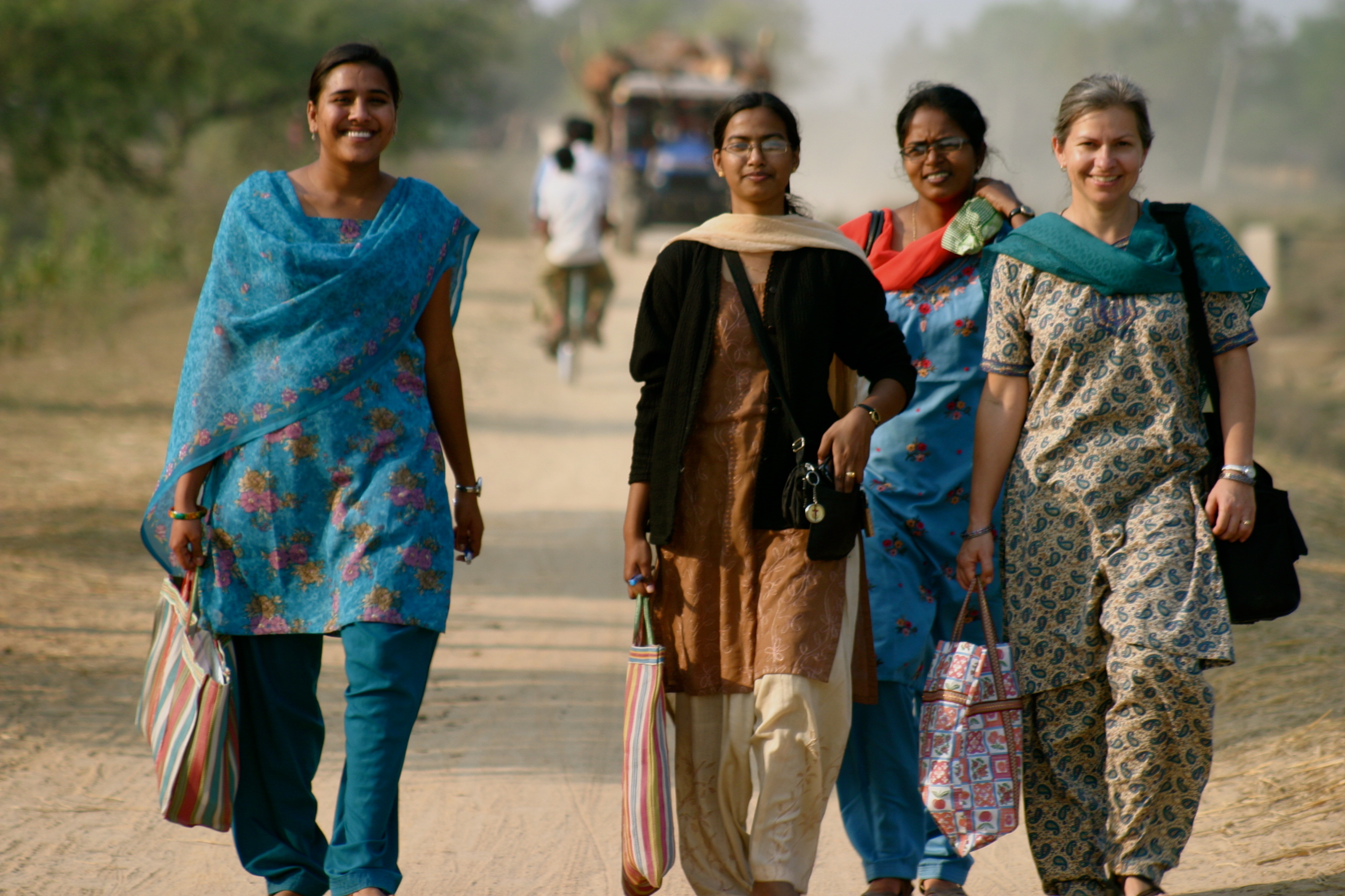 Women Walking on Dirt Road 