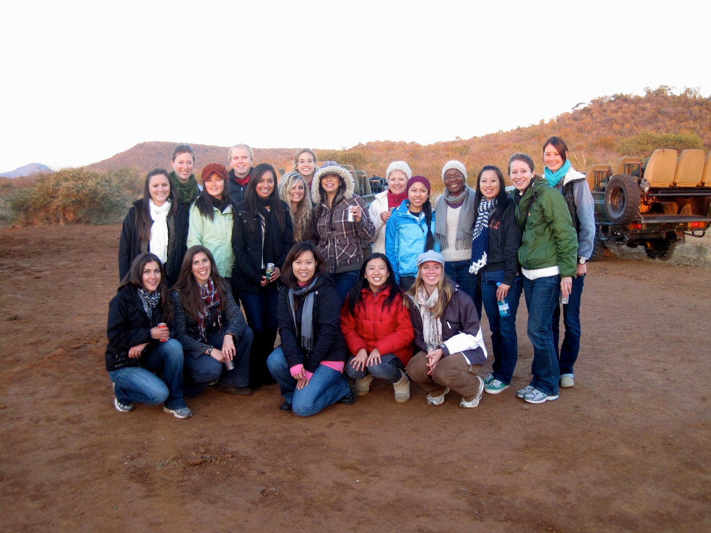 A Group of undergrad and NP students with two faculty during a safari game ride in South Africa.