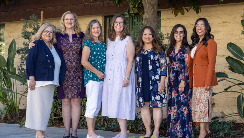women alumni smiling