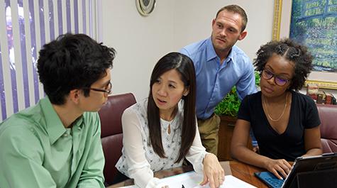 students and faculty work together